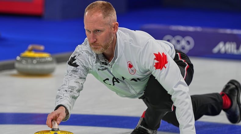 Canada's Brad Jacobs in action during the men's curling round robin session against Norway at the 2026 Winter Olympics, in Cortina d'Ampezzo, Italy, Thursday, Feb. 19, 2026. (AP Photo/Fatima Shbair)