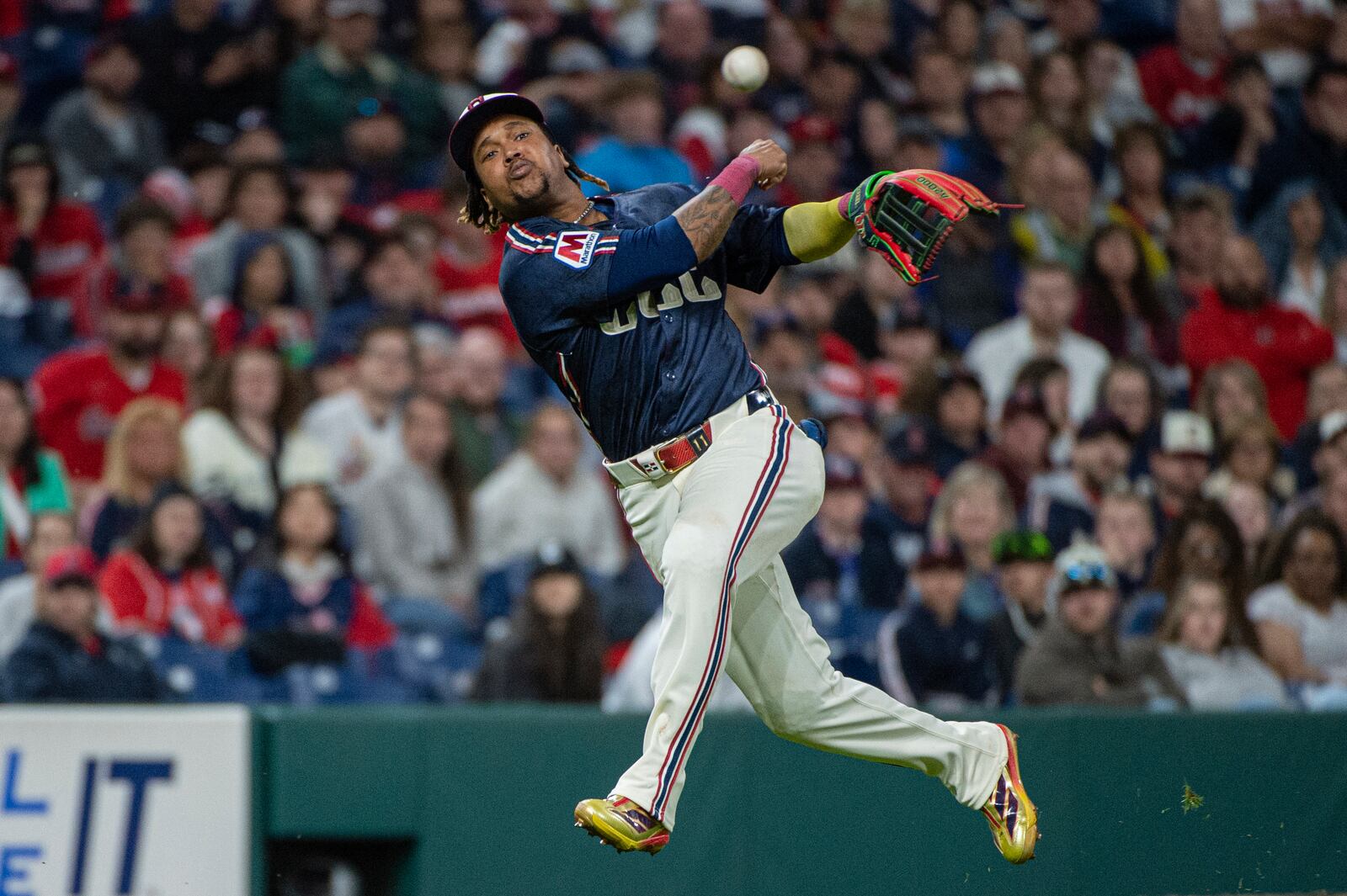 Cleveland Guardians' Jose Ramirez throws to first base but not in time to put out Los Angeles Angels' Logan O'Hoppe during the seventh inning of a baseball game, Friday, May 30, 2025, in Cleveland. (AP Photo/Phil Long)