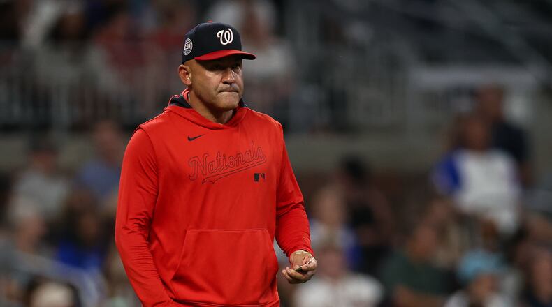FILE - Washington Nationals interim manager Miguel Cairo walks out to the mound to make a pitching change in the seventh inning of a baseball game against the Atlanta Braves, Tuesday, Sept. 23, 2025, in Atlanta. (AP Photo/Colin Hubbard, File)