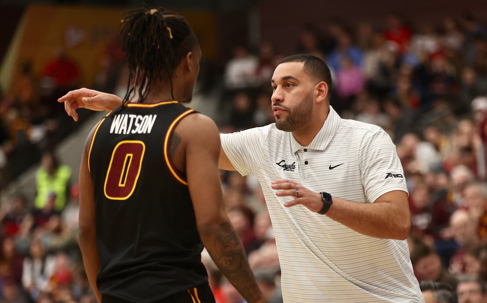 Loyola Chicago's Drew Valentine talks to Desmond Watson during a game against Dayton on Friday, Feb. 21, 2025, at Gentile Arena in Chicago. David Jablonski/Staff