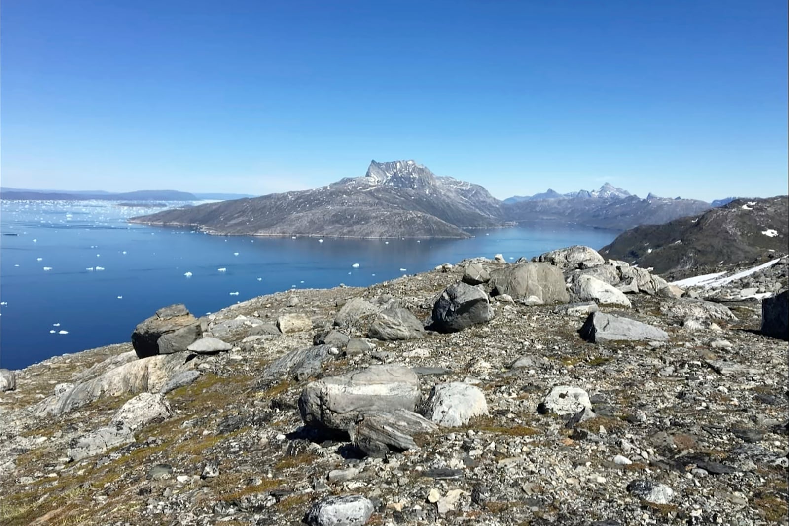 FILE - Small pieces of ice float in the water in Nuuk Fjord, Greenland, June 15, 2019. One of the world’s few rare earths processors outside China has bought exploration rights to mine in Greenland, opening an avenue for diversifying supplies of the minerals critical for advanced and green technologies. (AP Photo/Keith Virgo, File)