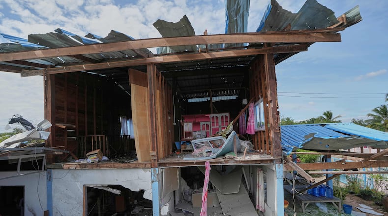 A house is seen damaged following a Thai soldier said was a Cambodian artillery strike in Sisaket province, Thailand, Sunday, Dec. 14, 2025. (AP Photo/Sakchai Lalit)