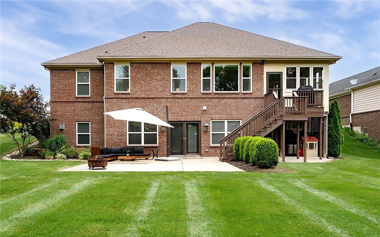 The home features a walk out basement, deck off the first floor and a concrete patio off the basement. The nearly half acre lot is lined with a creek and mature trees. CONTRIBUTED