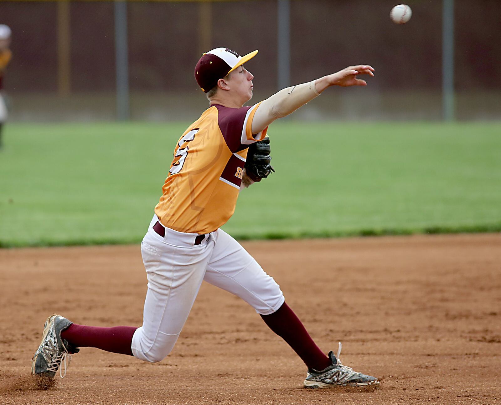 Ross third baseman Zach Evans sends a throw toward first base Thursday during a Division II sectional game against visiting Eaton. CONTRIBUTED PHOTO BY E.L. HUBBARD