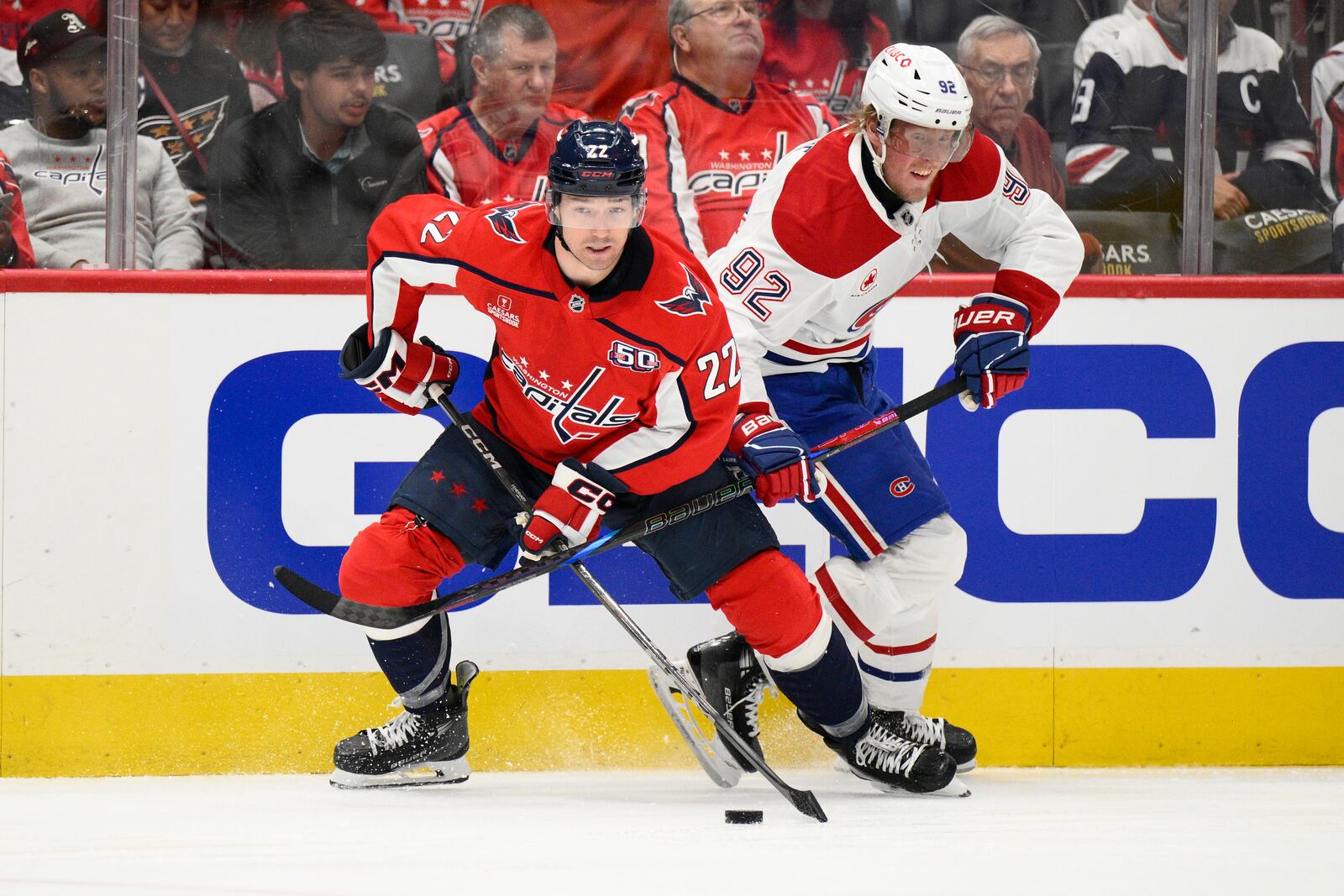 Montreal Canadiens right wing Patrik Laine (92) battles for the puck against Washington Capitals right wing Brandon Duhaime (22) in the second period of Game 1 of a first-round NHL hockey playoff series Monday, April 21, 2025, in Washington. (AP Photo/Nick Wass)