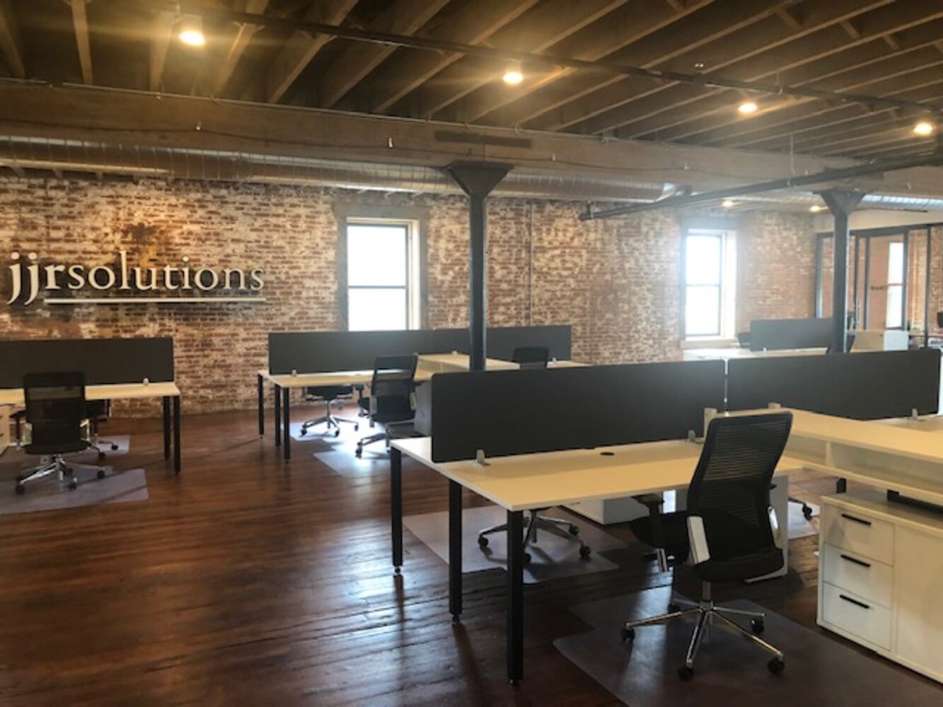 PHOTOS: Inside the new downtown Dayton office that has an industrial slide
