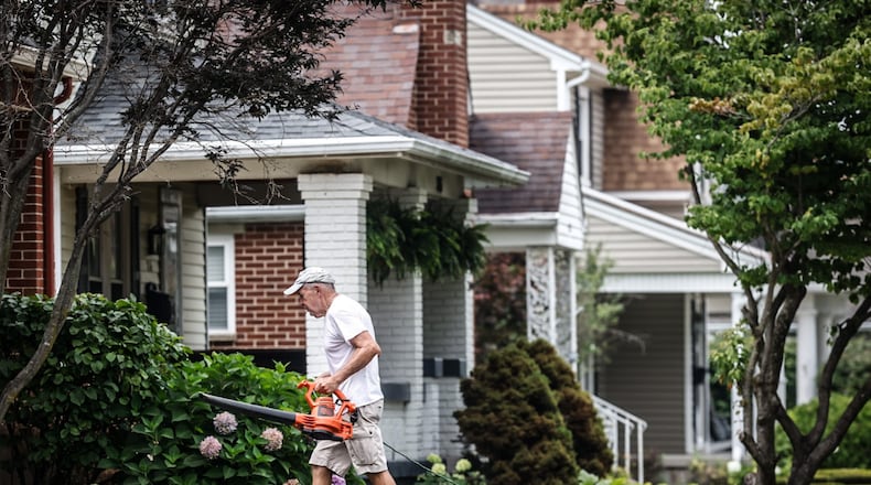 Bob Pack helps a friend with his lawn on Cushing Ave. in Kettering Thursday July 27, 2023. Most of the growth in residential value is in the southern part of county, including Kettering at $987 million increase in property values. JIM NOELKER/STAFF