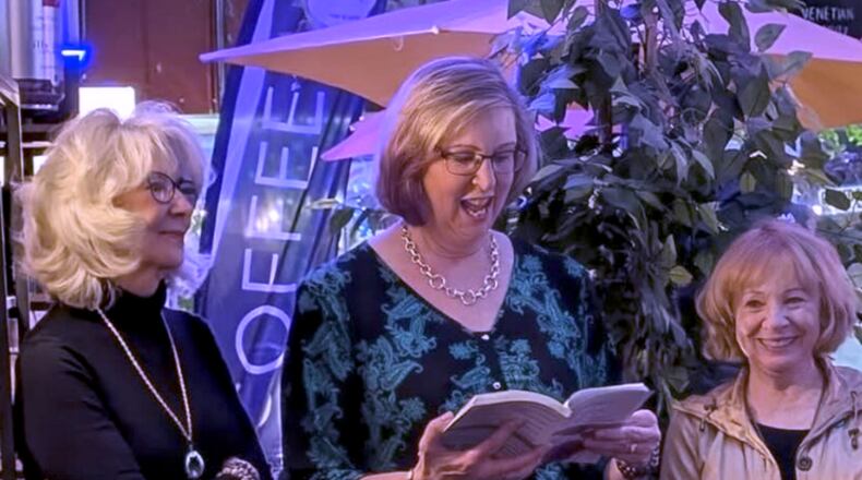 Rebecca LaChance (left) and her coauthors, Karen Smith-Racicot and Karen Justice, reading their book at the book launch in Frederick, MD in January. CONRIBUTED