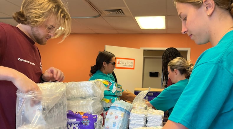 Students from Kettering College of Nursing help wrap and prepare diapers for Dayton Diaper Depot distribution.