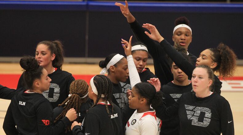 Dayton huddles before a game against Duquesne at UD Arena on Jan. 3, 2021. David Jablonski/Staff