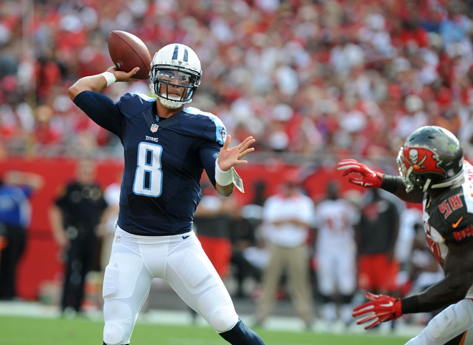 TAMPA, FL - SEPTEMBER 13: Quarterback Marcus Mariota #8 of the Tennessee Titans throws a twelve yard TD against the Tampa Bay Buccaneers in the first quarter at Raymond James Stadium on September 13, 2015 in Tampa, Florida. (Photo by Cliff McBride/Getty Images)