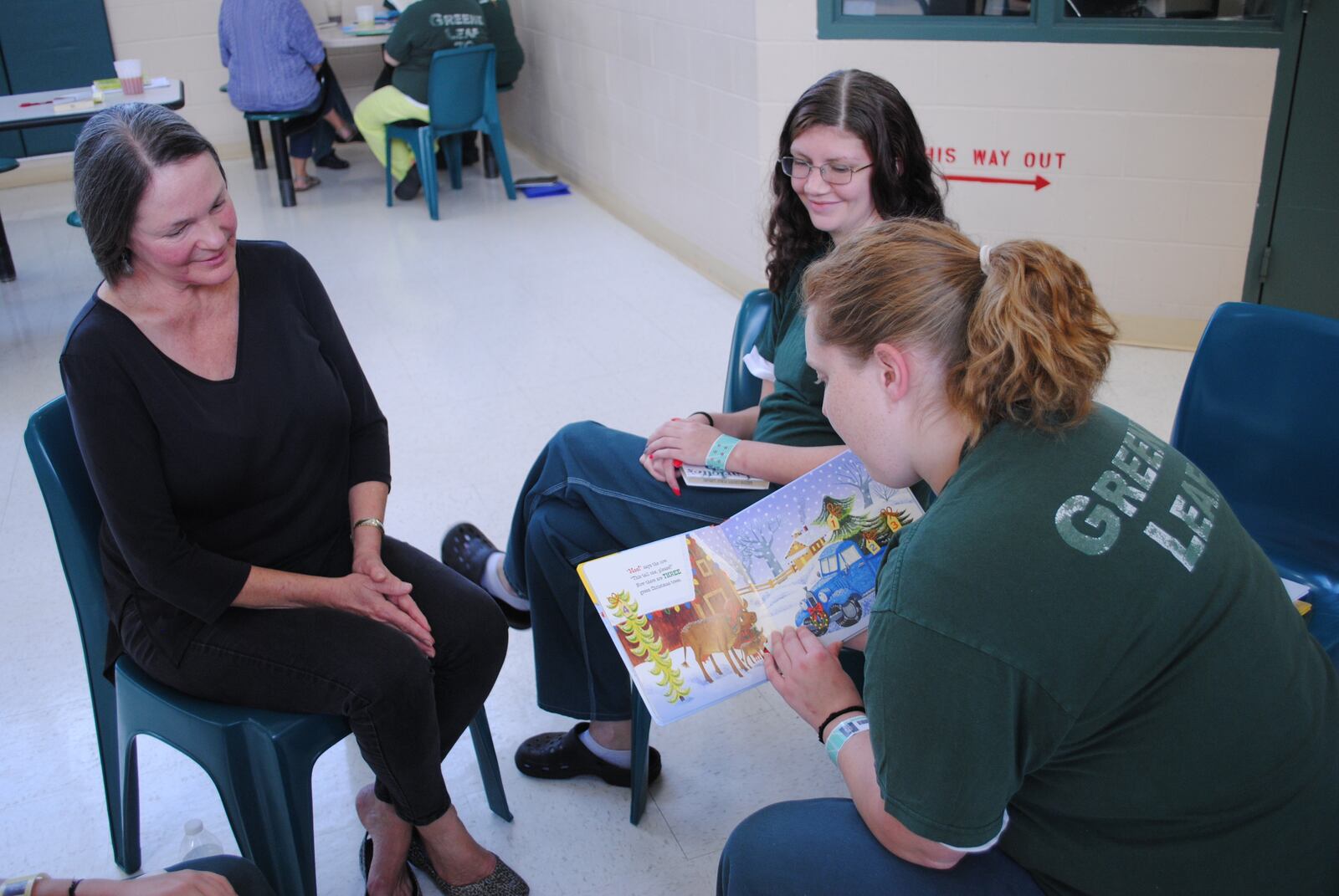 Educator Allison Meier workshopping with two mothers at the Greeneleaf program in Xenia. Participants read their stories and listeners give warm feed-back. (CONTRIBUTED)