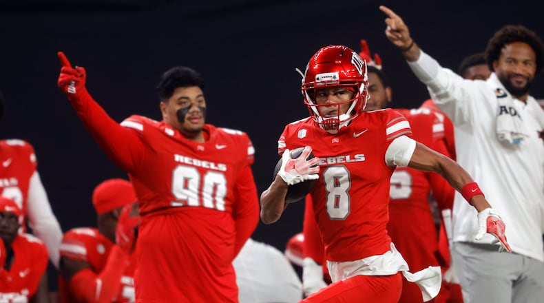 UNLV wide receiver Taeshaun Lyons (8) runs down the UNLV sideline for a touchdown after a pass reception during the first half of an NCAA college football game against Hawaii Friday, Nov. 21, 2025, in Las Vegas. (Steve Marcus/Las Vegas Sun via AP)
