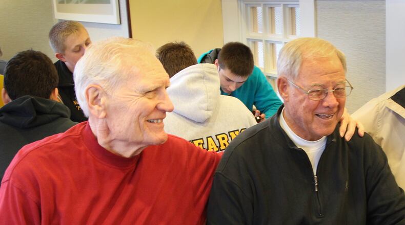 Chris Harris, right, will soon be joining the University of Dayton Athletic Hall of Fame. Before that, he joined former UD hoops notables for breakfast, including Bill Uhl, left.