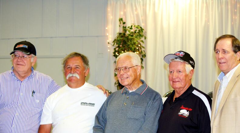 USAC official Dick Jordan (from left), open-wheel drivers Jack Hewitt, Mel Kenyon, Tom Bigelow and USAC announcer Gary Lee were honored at DARF’s USAC Night at Celebrations Banquet Center on Tuesday.