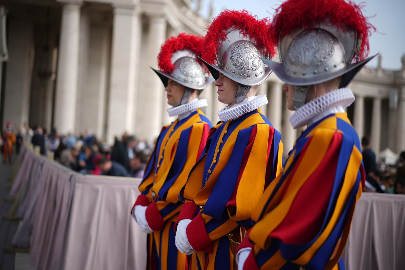 Pontifical Swiss guards wait for the start of the Easter mass in St. Peter's Square at the Vatican Sunday, April 20, 2025. (AP Photo/Andrew Medichini)