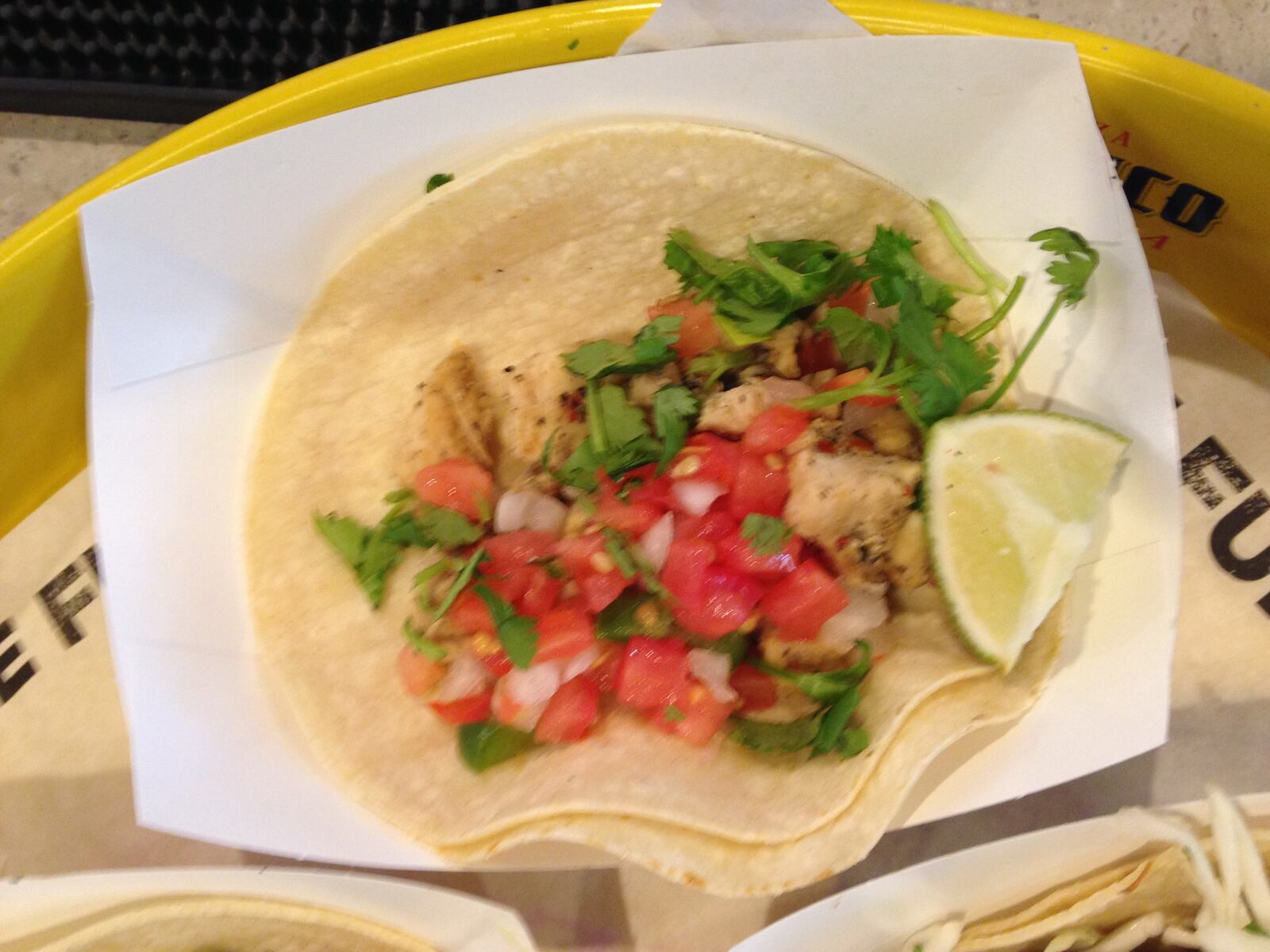 Seasoned chicken with pico de gallo and cilantro make the simple yet tasty chicken fajita tacos at R Taco.