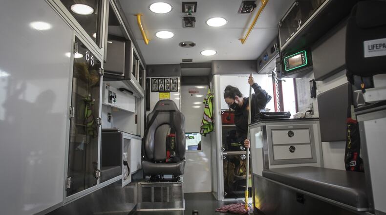 Sugar Creek Twp. EMS Firefighter, Kaitlyn Holbrook cleans out one of two ambulances at the Firehouse on Clyo Rd. Wednesday March 31, 2021. The township installed UV sanitizing equipment then purchased through the CARES Act funds now fears the state's 1,308 townships may be cut out of any assistance due to muddled wording in the American Rescue Plan.