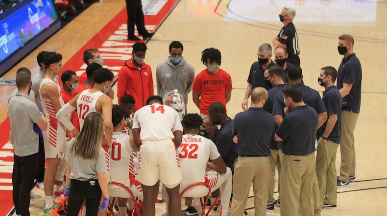 Dayton huddles during a game against Rhode Island on Saturday, Jan. 30, 2021, at UD Arena. David Jablonski/Staff