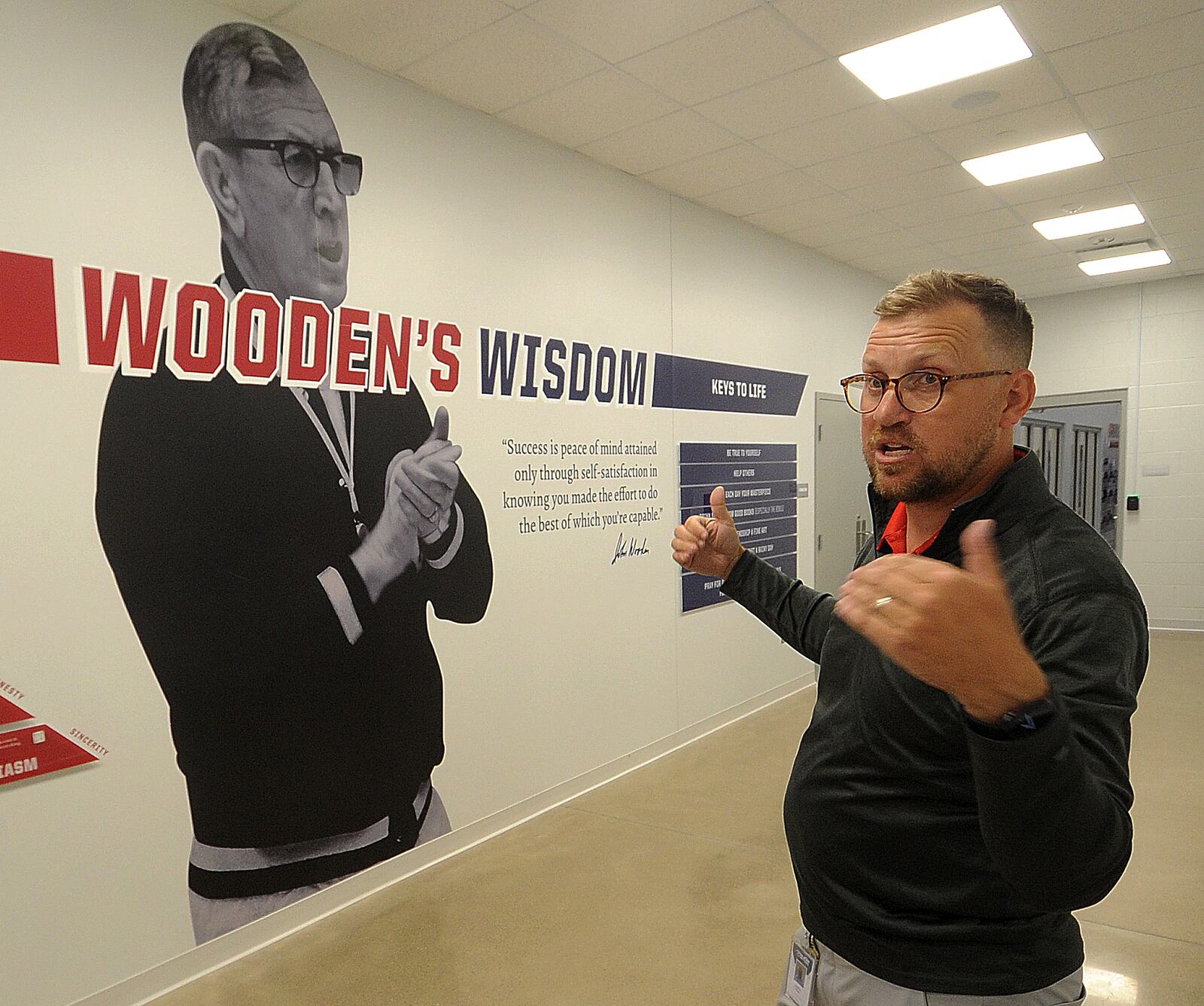 Jonathan Hauge, marketing manager for Athletes in Action, talks about the new Wooden Family Fieldhouse at the Athletes in Action Sports Complex, 1197 S. Detroit St. in Xenia. MARSHALL GORBY\STAFF