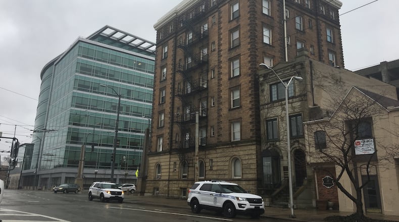 Dayton police visited the Newcom apartment building in downtown Dayton in January after the building’s ownership was given an order to vacate if the heating system was not repaired. CORNELIUS FROLIK / STAFF