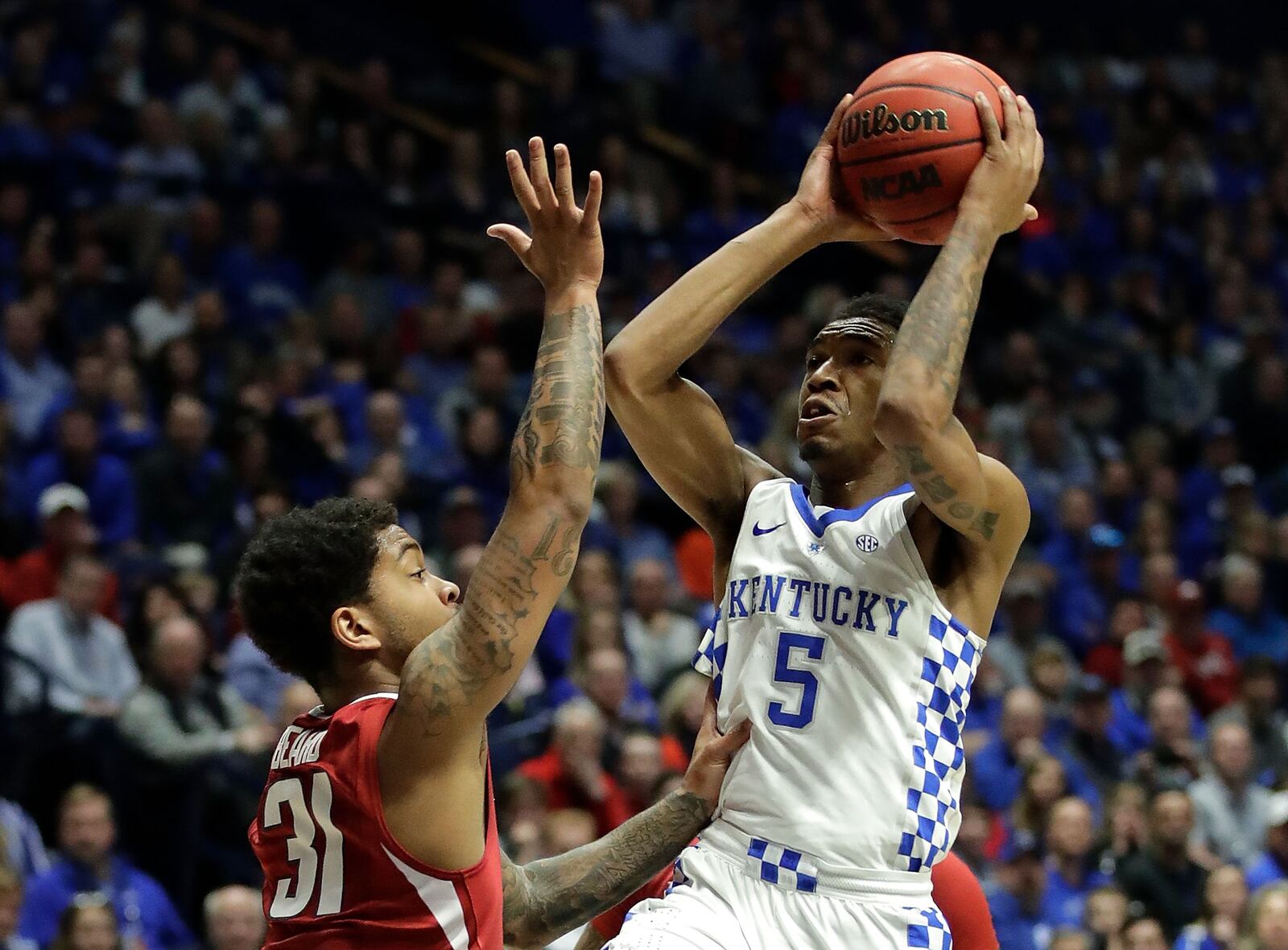 NASHVILLE, TN - MARCH 12: Malik Monk #5 of the Kentucky Wildcats drives against Anton Beard #31 of the Arkansas Razorbacks during the championship game at the 2017 Men’s SEC Basketball Tournament at Bridgestone Arena on March 12, 2017 in Nashville, Tennessee. (Photo by Andy Lyons/Getty Images)