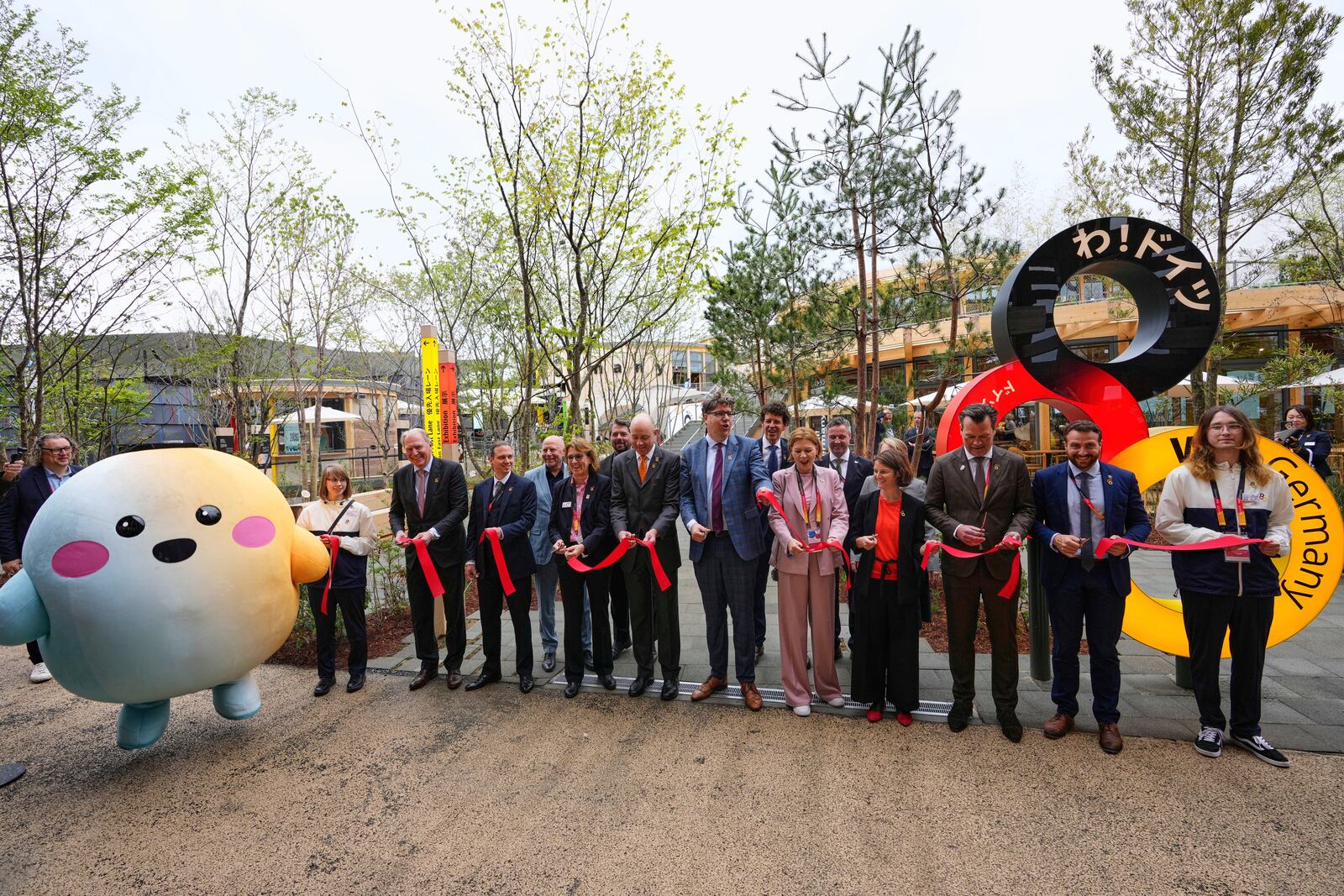 Officials participate in the opening of Germany's pavilion on the opening day of the Expo 2025 in Osaka, central Japan, Sunday, April 13, 2025. (AP Photo/Hiro Komae)