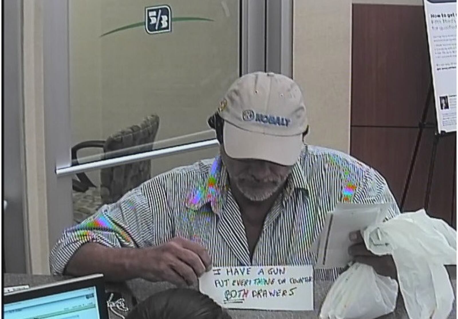 Police are asking for help to identify this man who held up Fifth Third Bank inside Kroger Thursday evening, Sept. 7, 2017, in Miamisburg.