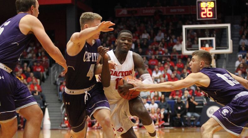 Dayton’s Jalen Crutcher drives to the basket against Capital in an exhibition game on Friday, Nov. 2, 2018, at UD Arena. David Jablonski/Staff