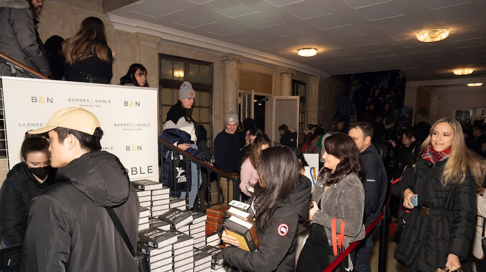 Audience members attend author Rebecca Yarros in conversation of her new book "Onyx Storm" at The Town Hall on Friday, Jan. 24, 2025, in New York. (Photo by CJ Rivera/Invision/AP)