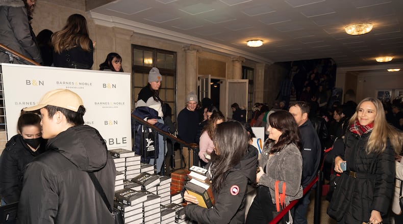 Audience members attend author Rebecca Yarros in conversation of her new book "Onyx Storm" at The Town Hall on Friday, Jan. 24, 2025, in New York. (Photo by CJ Rivera/Invision/AP)
