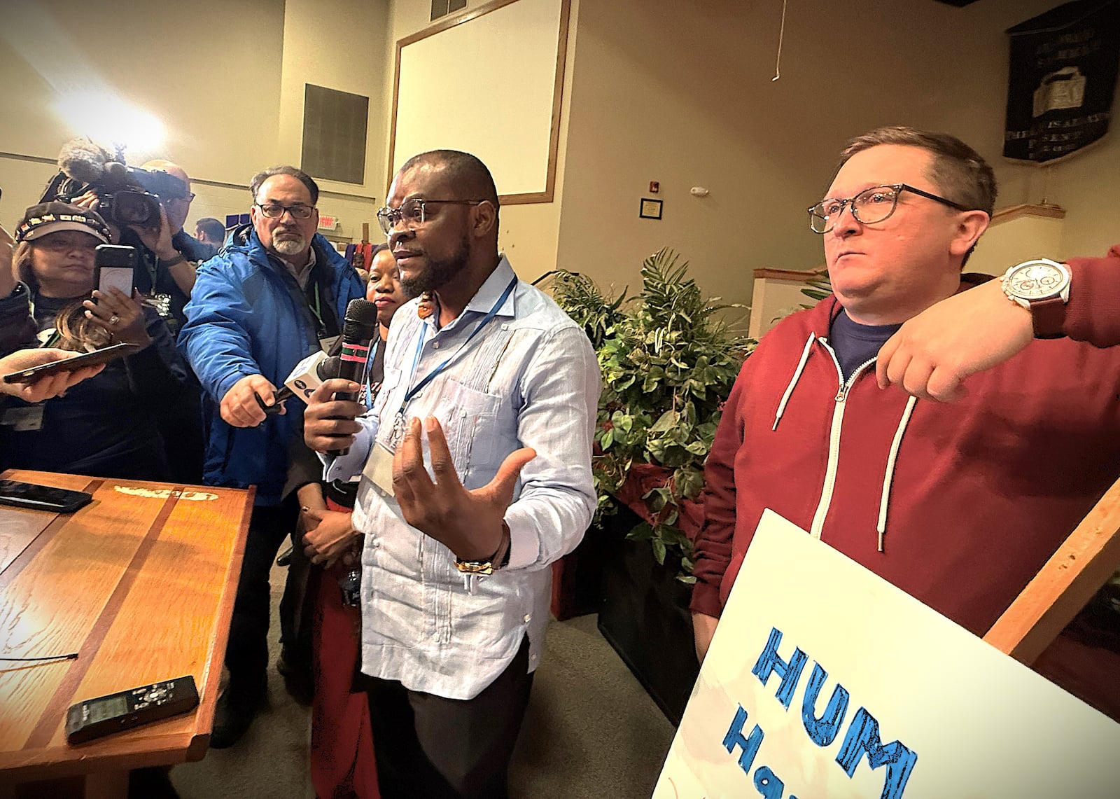 Viles Dorsainvil, the co-founder and executive director of the Haitian Community Help & Support Center in Springfield, spoke at a community event in Springfield on Monday, Feb. 2, 2026, in support of extending temporary protected status for Haiti. Dorsainvil and his brother are plaintiffs in lawsuits challenging the Trump administration's cancellation of TPS for Haitians. He stood next to Geoff Pipoly, lead counsel in a federal court case in Washington, DC. CORNELIUS FROLIK / STAFF