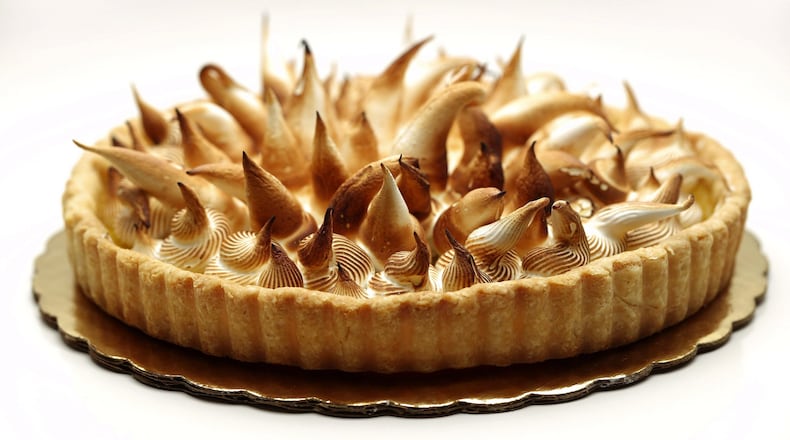 Get out the kitchen torch to brown the spiky meringue you’ve piped onto the sweet-tart lemon curd. (Joan Moravek/food styling) (E. Jason Wambsgans/Chicago Tribune/TNS)