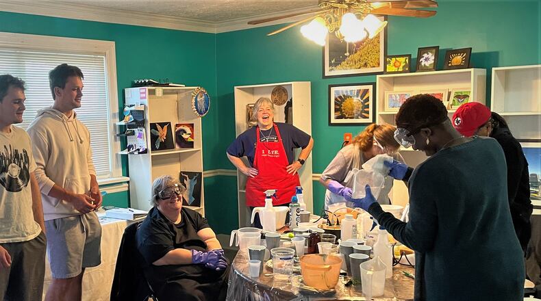 Margaret Neff, owner of Nature’s Touch Soaps, teaches University of Dayton students at the Clifton Crafthouse. CONTRIBUTED