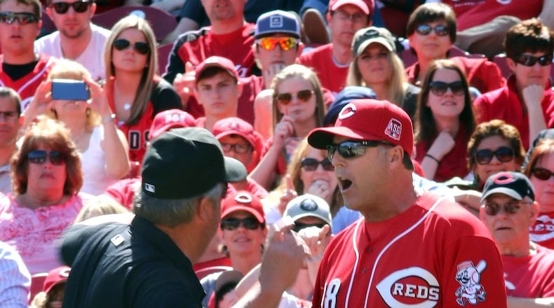 FILE - In this Sunday, April 12, 2015, file photo, Cincinnati Reds manager Bryan Price is ejected by umpire Joe West while arguing a call against the St. Louis Cardinals in the seventh inning of a baseball game, in Cincinnati. Price went on a profanity-filled rant during his pregame meeting with media, Monday, April 20, 2015, taking exception with the way his team was being covered. (AP Photo/Tom Uhlman, File)