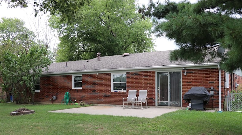 Patio doors open from the family room to a concrete patio and fenced back yard.