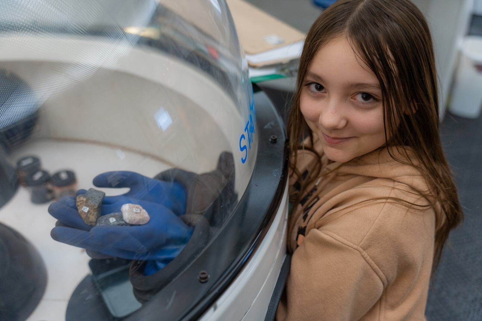 A Kiser Elementary student holds rock samples collected during a simulated expedition at the Dayton Public Schools Challenger Learning Center. CONTRIBUTED