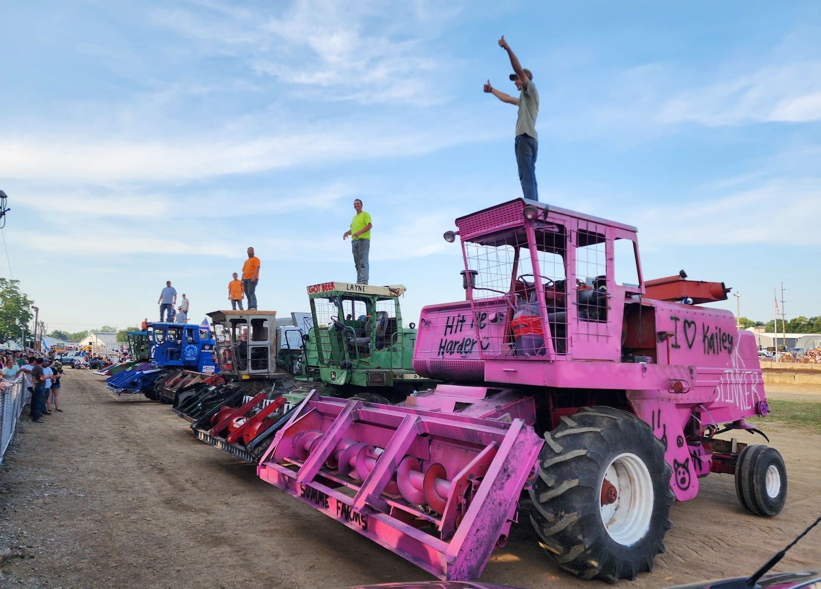 A large crowd gathered in the grandstand to watch the combine derby Saturday, July 27, 2024 at the Butler County Fair in Hamilton. The infield was busy in between rounds as contestants and crews worked to put the machines back together for the final round. NICK GRAHAM/STAFF