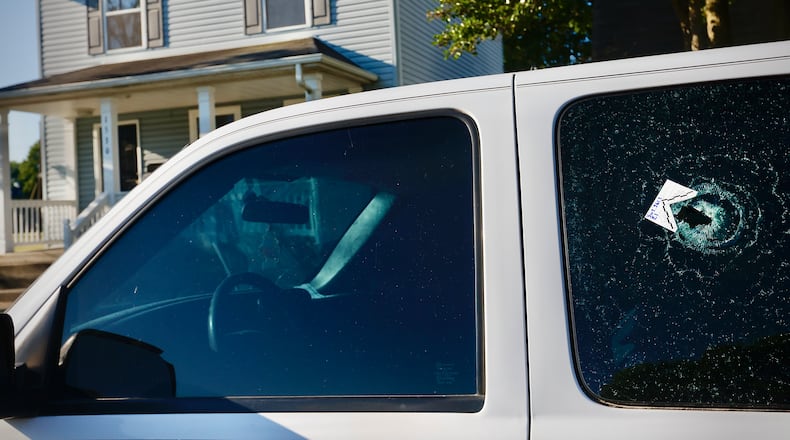 Multiple people were taken to the hospital following a shooting in Dayton on Home Avenue near South Euclid Avenue early Monday, June 24, 2024. Several vehicles, including this truck, have bullet holes from the shooting. MARSHALL GORBY \STAFF