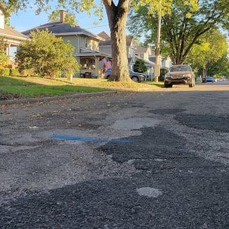 A section of road along King Street in Xenia has been patched many times over the years, to the point residents say they avoid driving over it. Xenia voters will consider a levy this fall intended to fix streets like this one. LONDON BISHOP/STAFF