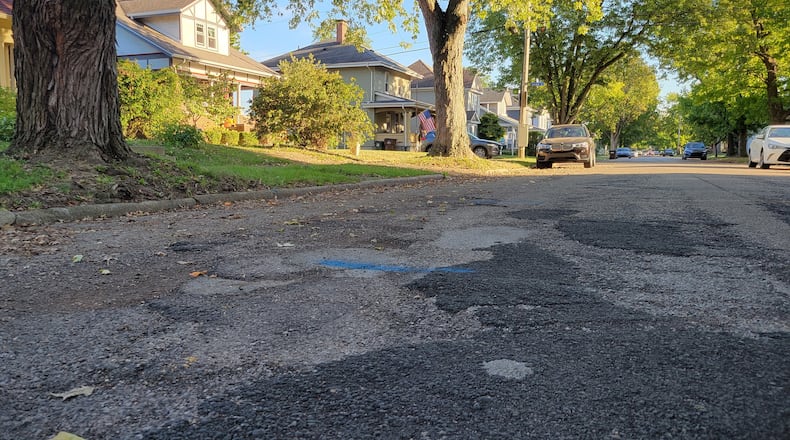 A section of road along King Street in Xenia has been patched many times over the years, to the point residents say they avoid driving over it. Xenia voters will consider a levy this fall intended to fix streets like this one. LONDON BISHOP/STAFF