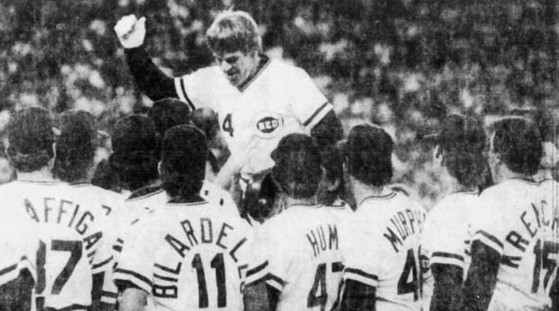 Pete Rose celebrates with teammates after his record-breaking 4,192nd hit on Sept. 11, 1985, at Riverfront Stadium in Cincinnati. Dayton Daily News photo by Charles Steinbrunner