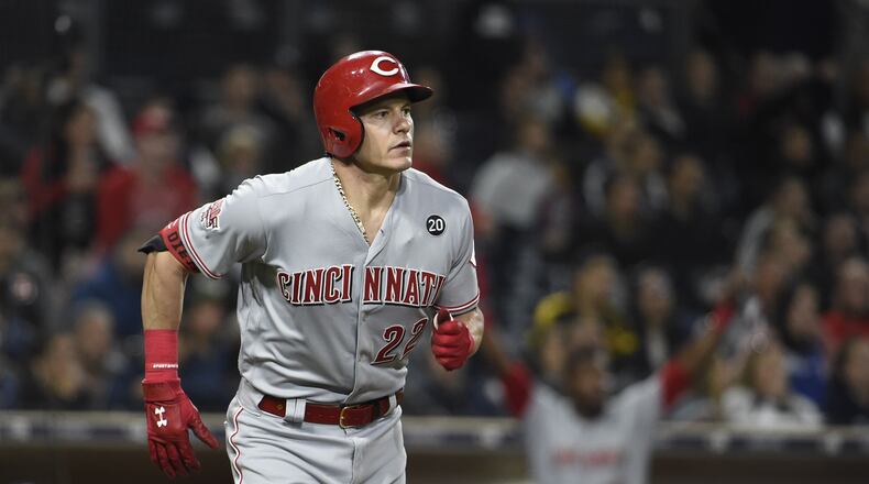 SAN DIEGO, CA - APRIL 19: Derek Dietrich #22 of the Cincinnati Reds watches the flight of his two-run home run during the eleventh inning of a baseball game against the San Diego Padres at Petco Park April 19, 2019 in San Diego, California.  (Photo by Denis Poroy/Getty Images)