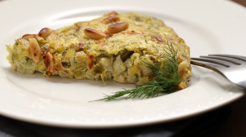 A frittata with leeks, feta and pine nuts is flavored with fresh dill and a bit of lemon zest. (E. Jason Wambsgans/Chicago Tribune/TNS)