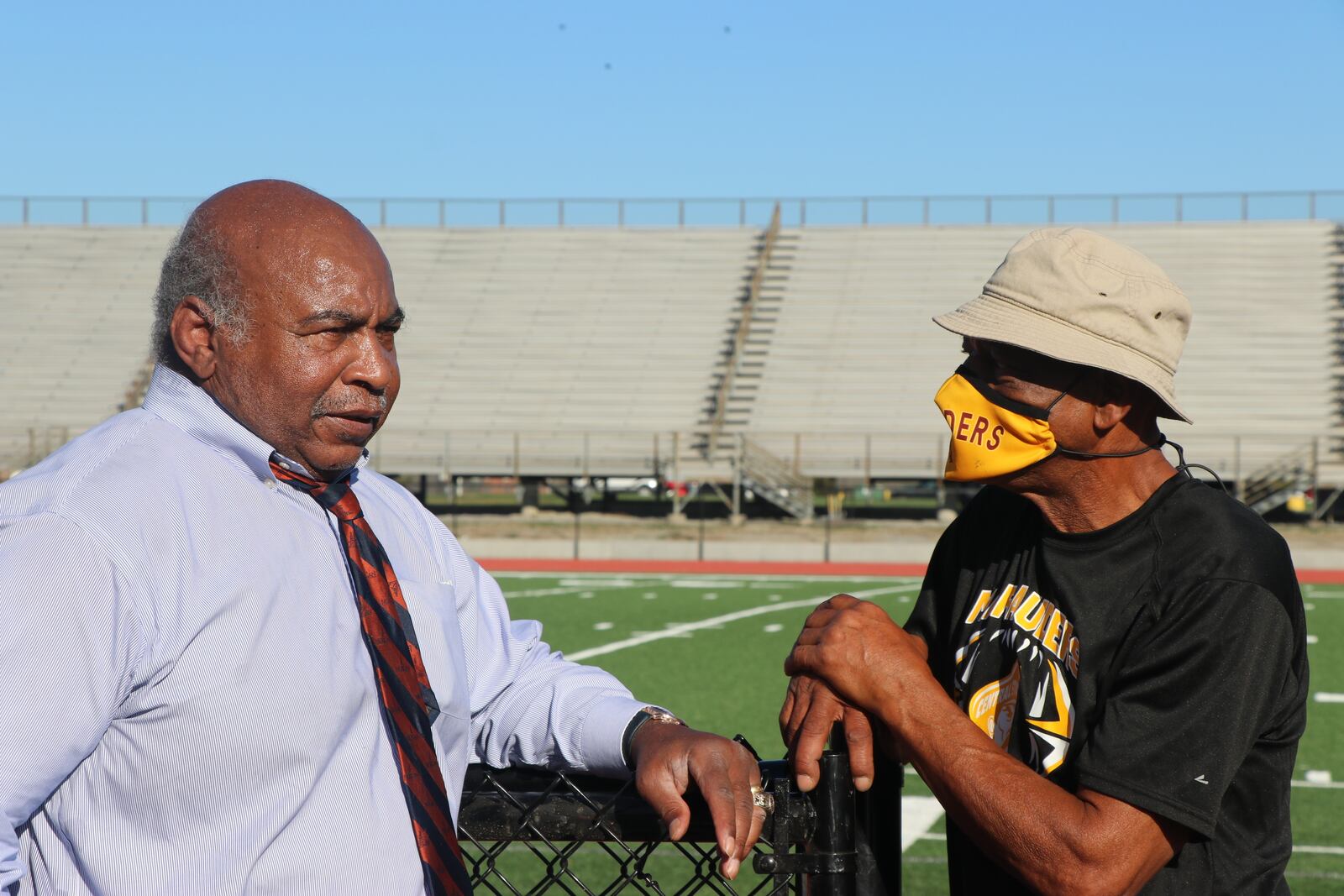 Pro Football Hall of Famer Willie Lanier (left)) and Central State assistant football coach George Ragsdale stand alongside the new turf field at McPherson Stadium. Lanier grew up in Clover, Virginia and Rasdale grew up 80 miles away in Dinwiddie. Va.  Ragsdale idolized the older football Lanier. Both went to HBCU’s and then on to the NFL, Lanier for 11 years with the Kansas City Chiefs and Ragsdale for three years with Tampa Bay. Photo courtesy of Nick Novy/Central State Athletics