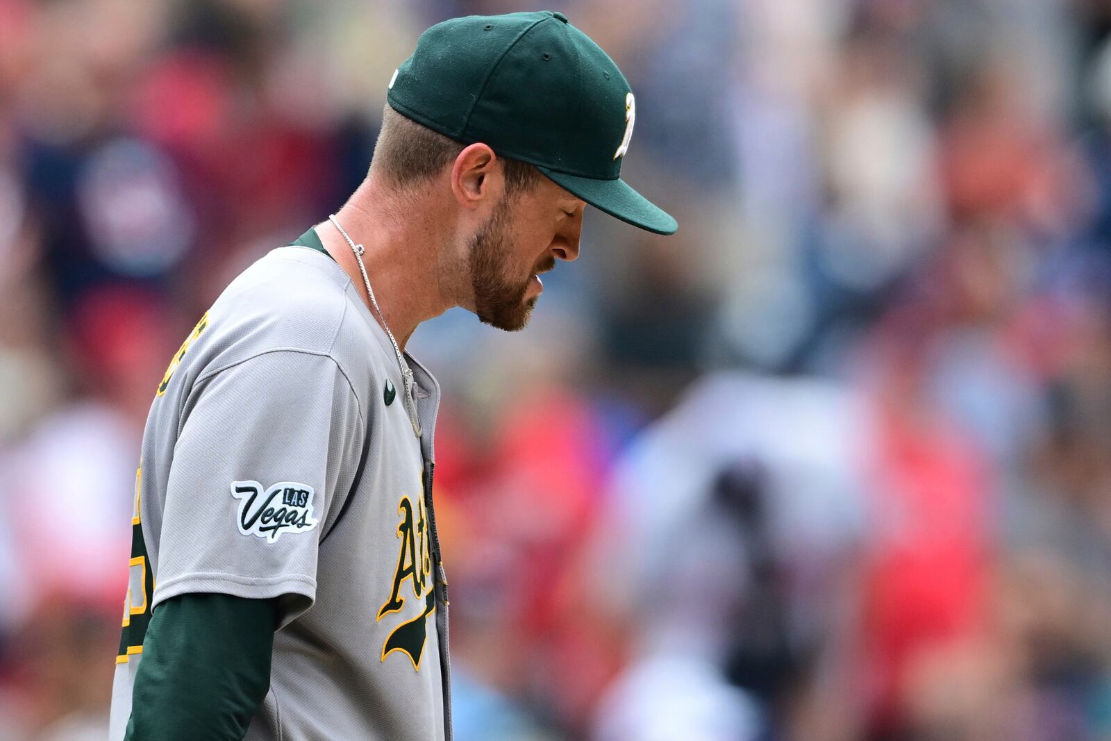 Athletics starting pitcher Jeffrey Springs reacts after a three RBI double by Cleveland Guardians' David Fry during the fourth inning of a baseball game, Sunday, July 20, 2025, in Cleveland. (AP Photo/David Dermer)