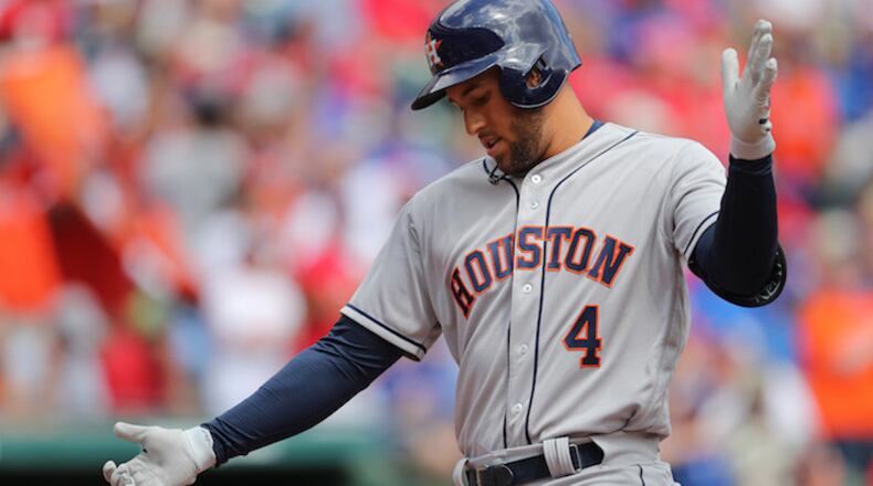 Houston Astros right fielder George Springer (4) hits a lead off homer in the first inning as the Houston Astros play the Texas Rangers on opening day of Major League Baseball at Globe Life Park Thursday, March 29, 2018 in Arlington, Texas. (Rodger Mallison/Fort Worth Star-Telegram/TNS)