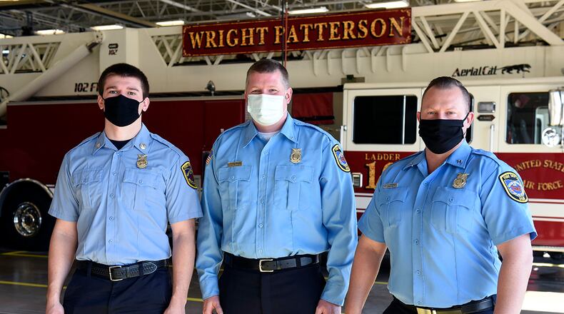 Three Air Force firefighters from the 788th Civil Engineer Squadron were promoted during a ceremony at Wright-Patterson Air Force Base on March 29. From left are new firefighter Ryan Hartmann, Lt. Chad Engman and Capt. James Hammond. U.S. AIR FORCE PHOTO/TY GREENLEES