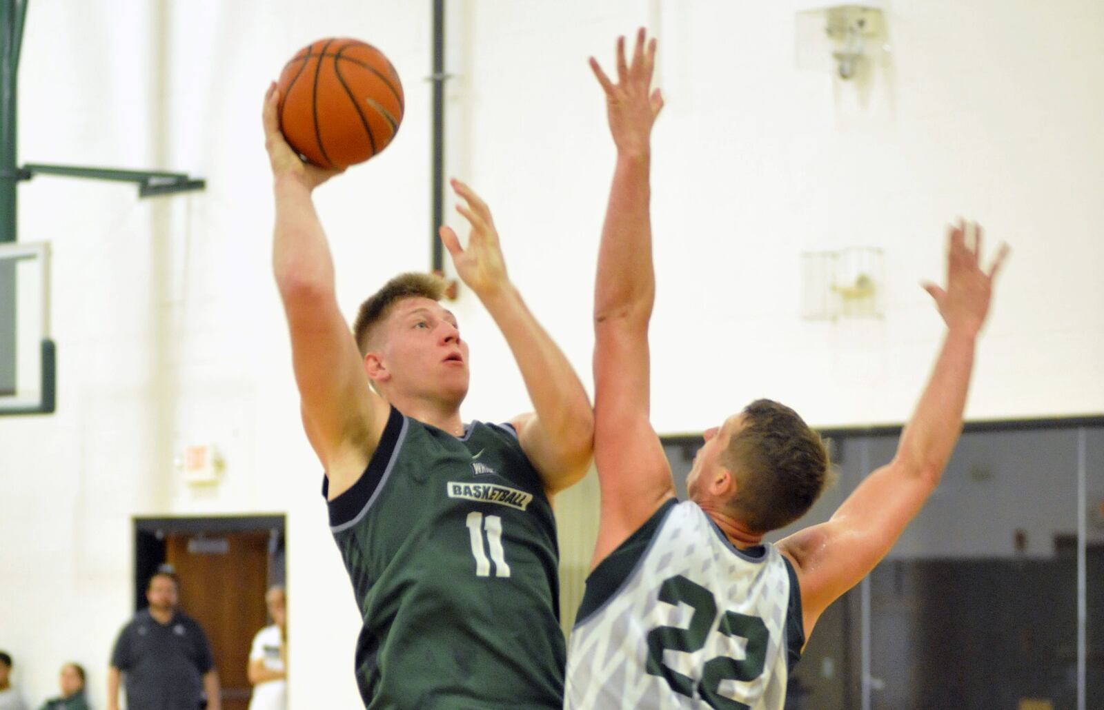 Wright State freshman Loudon Love puts up a shot over junior Parker Ernsthausen during summer practice Thursday at the Setzer Pavilion.