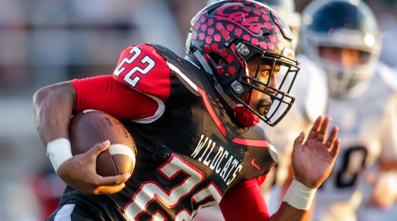 Franklin’s Ryan Montgomery carries the ball during their game against Valley View on Friday night at Veterans Memorial Field at Atrium Stadium in Franklin. NICK GRAHAM/STAFF
